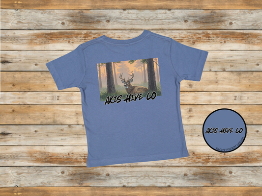 Buck laying in grass